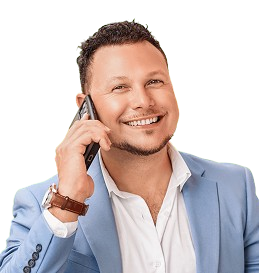 Smiling man in a light blue blazer using a smartphone, representing SharpShell Digital's team expertise and client engagement in digital marketing solutions.