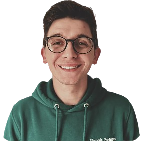 Smiling man in a green hoodie with "Google Partners" logo, representing SharpShell Digital's team expertise in digital marketing and advertising.