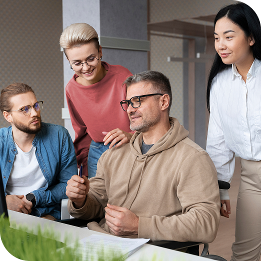 Team collaborating in a modern office setting, discussing digital marketing strategies and project development, reflecting SharpShell Digital's focus on teamwork and business automation.