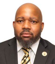 Marshall White, Client Delivery Manager and Execution Excellence Officer at SharpShell Digital, wearing a suit with a striped tie, presenting a professional demeanor.