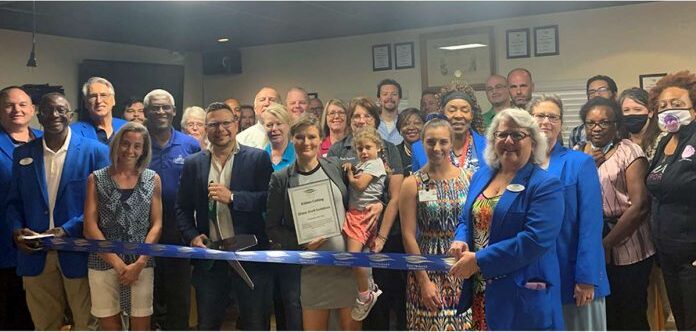 Group of people at a ribbon-cutting event for SharpShell Solutions, LLC, celebrating the launch of the business focused on small business growth and digitization in Central Florida.